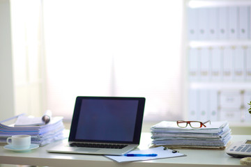 office desk a stack of computer paper reports work forms