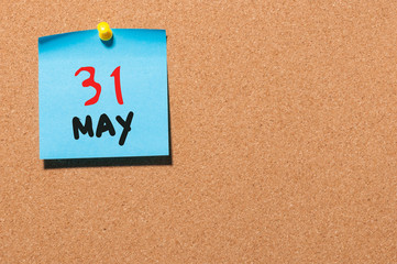 May 31st. Day 31 of month, calendar on cork notice board, business background. Spring time, empty space for text