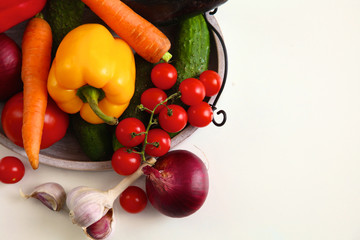 Composition with assorted raw organic vegetables wooden table