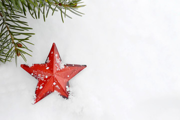 Christmas card: Christmas star ornament in the snow