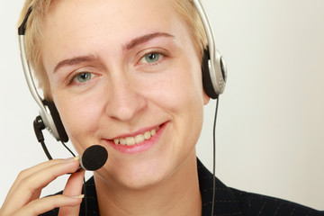 Happy friendly service agent in call centre