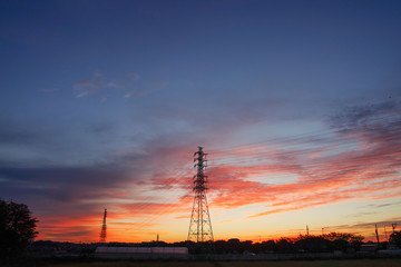 morning glow and transmission line iron tower