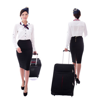 front and back view of young stewardess walking with suitcase is