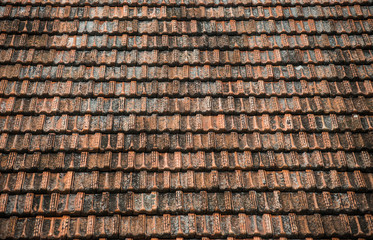 Texture of old weathered red roof tiles. 