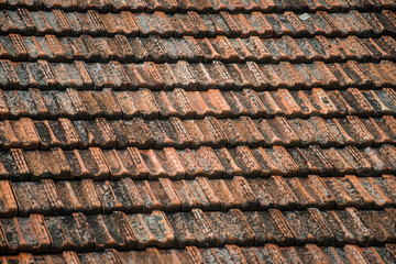Texture of old weathered red roof tiles. 