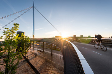 Cyclist going over the City Bridge (Byens bro) in Odense, Denmar
