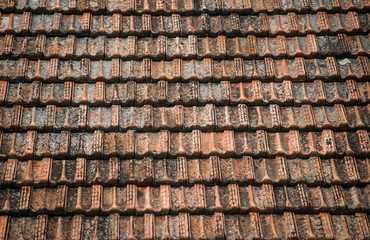 Texture of old weathered red roof tiles. 