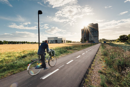 CYclist on a bicycle path in Odense, Denmark
