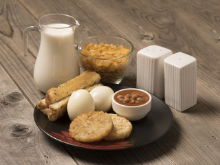 continental breakfast -Boiled egg and fried beans