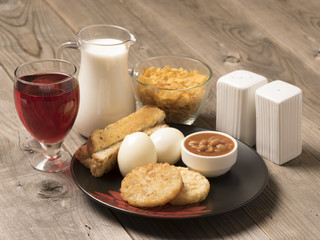 continental breakfast -Boiled egg and fried beans