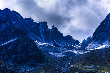 dramatic picture with mountain peak in alps