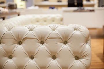 White armrest of a  luxury leather sofa