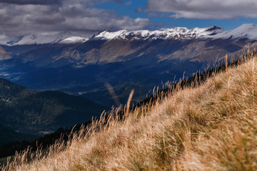 Mountain valley on the background of ranges and snow peaks Altai Mountains, Russia