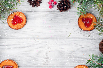 Christmas tree branches on wood background