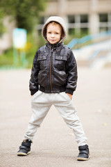 portrait of adorable little urban boy wearing black leather jack © nata_zhekova