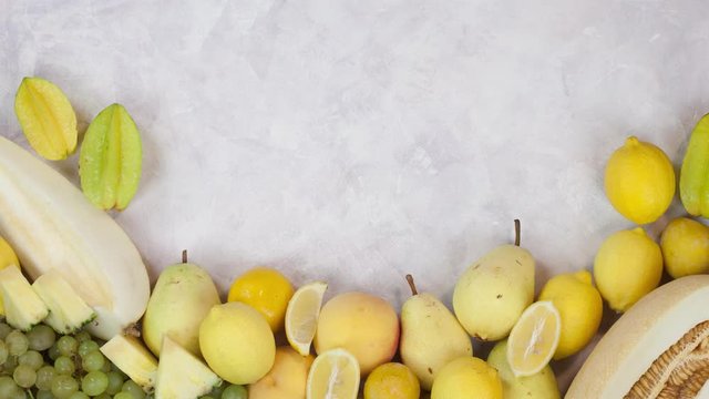 Yellow Fruits stop motion animation with copy space 4k intro video background. Healthy fresh food moving on white table
