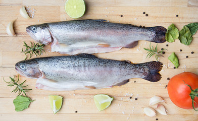 rainbow trouts on wooden cutting board