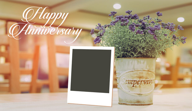 Instant photo frame on happy anniversary beautiful spring flower
