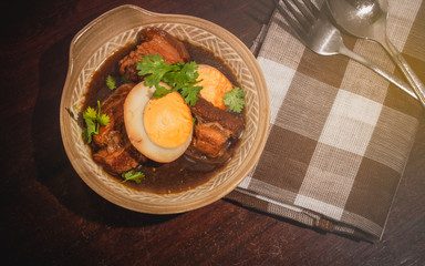 Stewed pork belly with chicken eggs from top view.