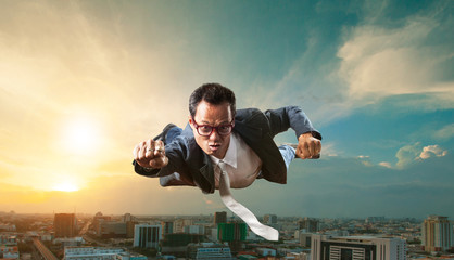 business man flying over skyscraper for business successful and