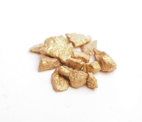 Golden nuggets on white