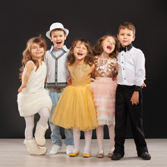 Group of fashionable kids in celebratory clothes
