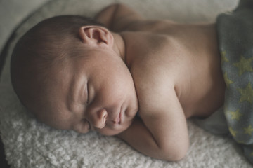 Portrait of sleeping newborn baby close up