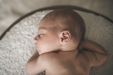 Portrait of sleeping newborn baby close up