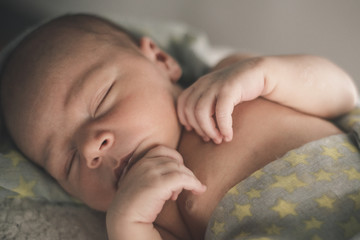 Portrait of sleeping newborn baby close up