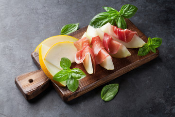 Fresh melon with prosciutto and basil