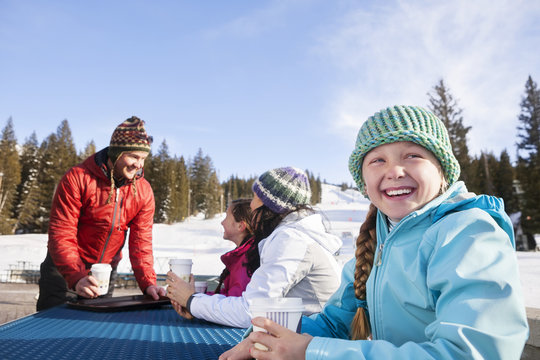 Girl Looking Away While Having Coffee With Family