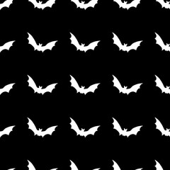 White bats abstract seamless pattern on black background.