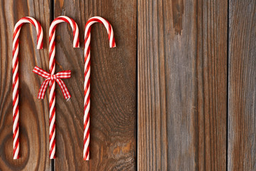 Fototapeta premium Christmas cane on wooden background