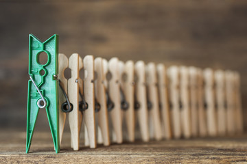 Leadership concept colorful wooden clothespin business concept, leader & success. selective focus,...