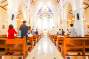Fototapeta na wymiar blurred christian mass praying inside the church