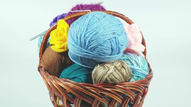 Balls of varicoloured threads in a basket for needlework. 4К