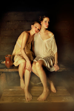 Two women sitting in sauna