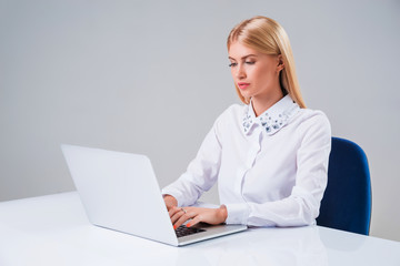 Young businesswoman working at laptop computer