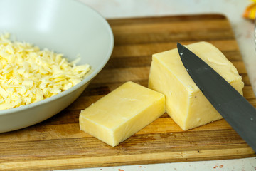 Cheddar cheese sliced and shredded