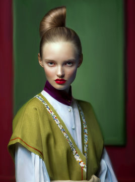 Portrait of young blonde woman with unique hairstyle