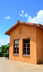 Beautiful orange house over blue sky