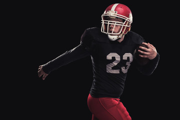 Football player on dark background