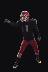 Football player on dark background