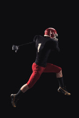 Football player on dark background