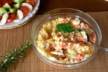Homemade Potato Salad with Eggs and Carrots Decorated On A Glass Bowl