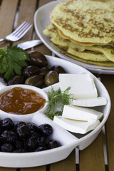Crepes or pancakes with jam, olive and cheese