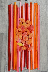 Gummy Bear Candy Colorful Background on colored wooden chopstick