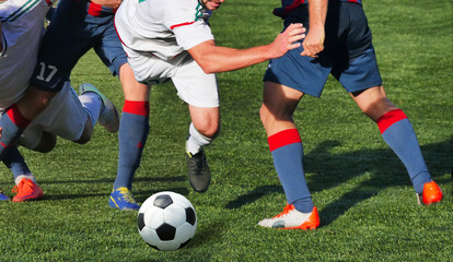 Fototapeta na wymiar Soccer player legs in action
