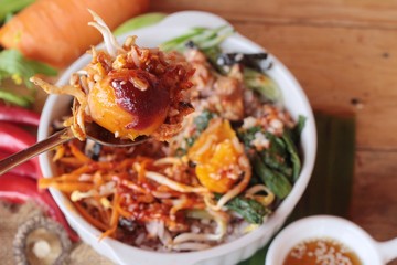 Bibimbap korean food is delicious on wood background.