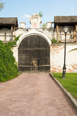 gate in the park of an ancient monastery